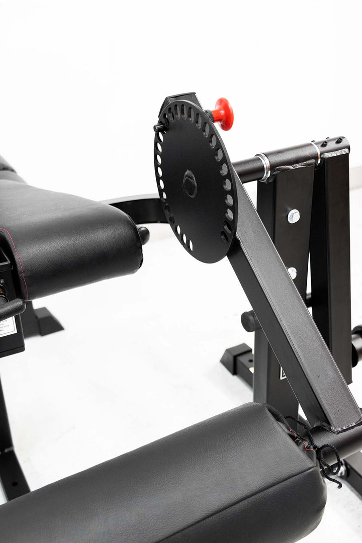 Red pop pin adjustment on leg curl and leg developer machine