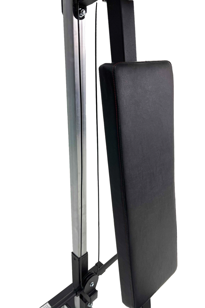 Black padded back rest on exercise machine