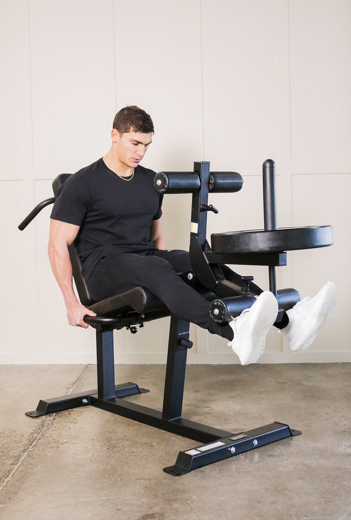 Man doing leg extensions on leg extension machine
